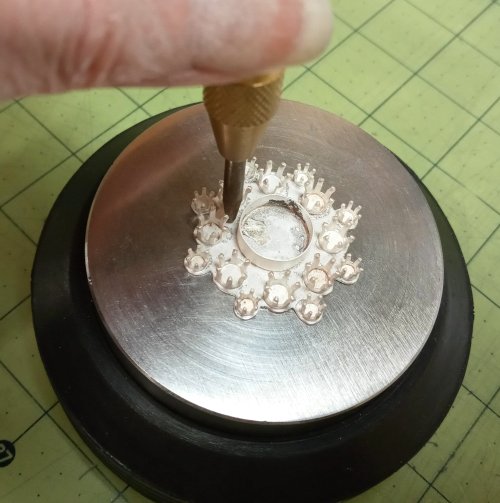 Judy Larson's CZ Explosion Necklace - , Holiday Designs, Cutting, Cutting Tool, Cutters, Filing, Finishing, How To Punch Holes, Hole Punching, Punch A Hole, Tumbling, Tumble, Tumbling Jewelry, Butane Torch, Soldering, Solder, Design, Drilling, Drill,  Place the assembly on a bench block